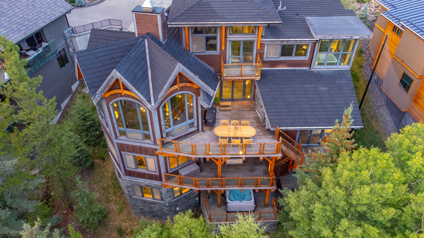 Aerial view of 821 Silvertip Heights and its timber decks above the Silvertip fairways