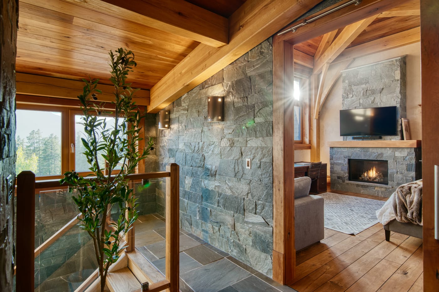 Second living area with a fireplace and mountain views