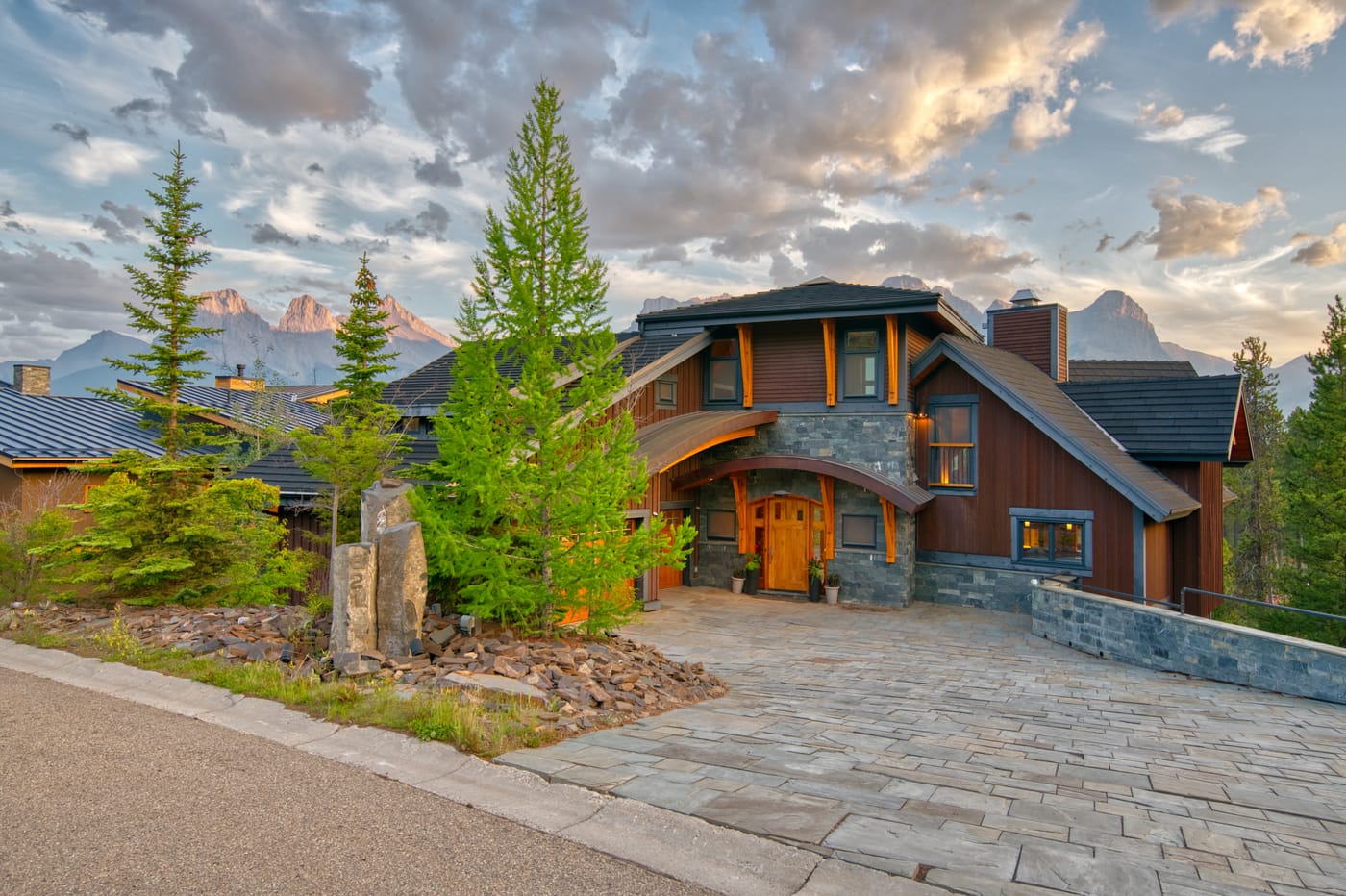 Timber-and-stone lodge exterior on the Silvertip fairways in evening light