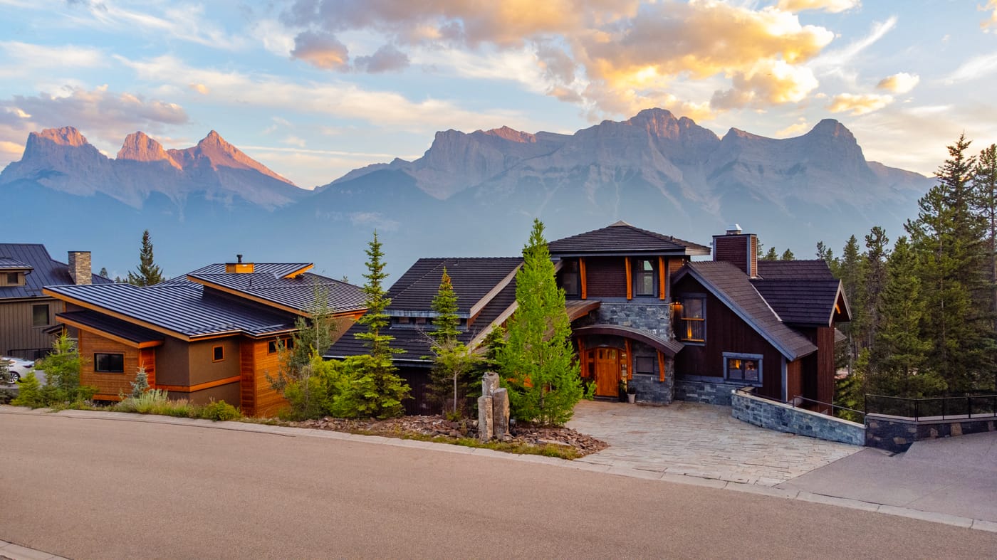 The lodge set against the Canmore Rockies at golden hour