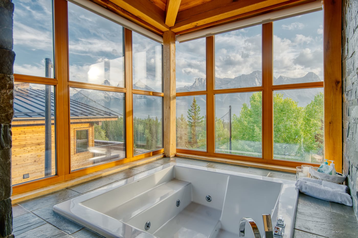 Spa bath with a soaking tub framing the mountains